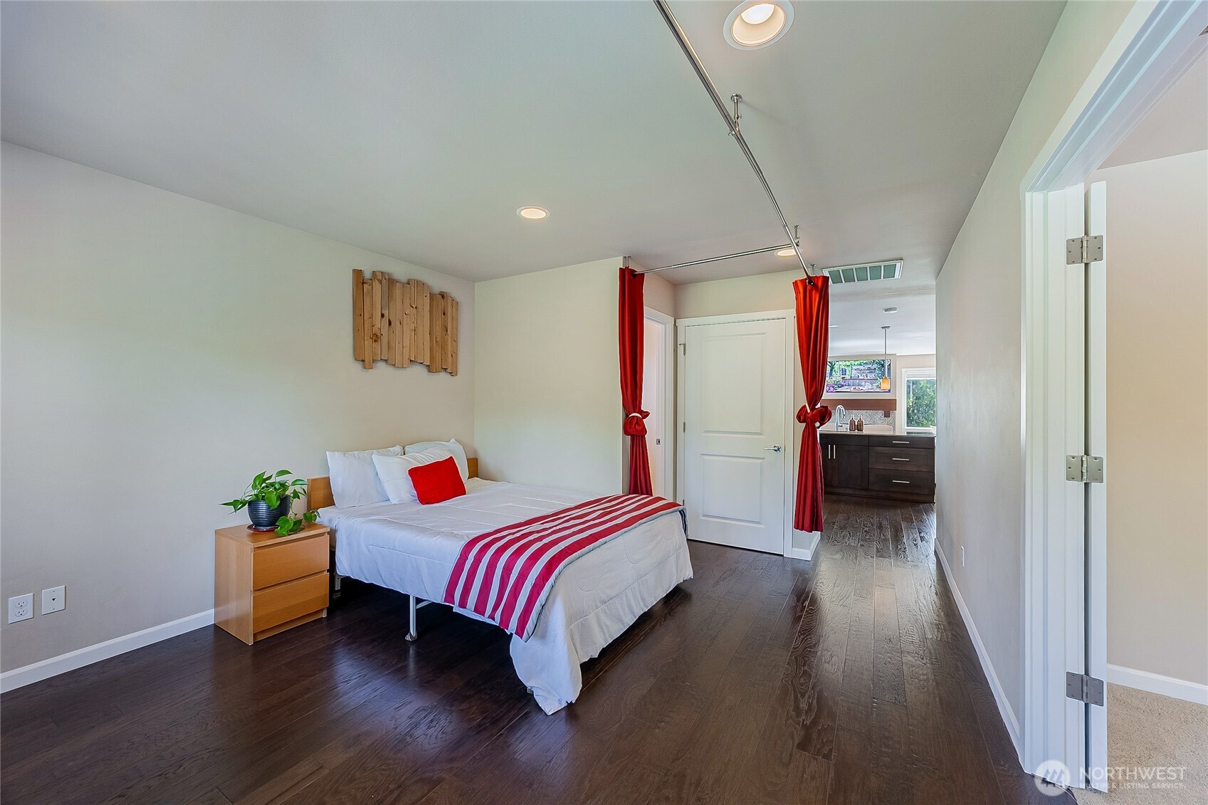 11501 87th Avenue South Seattle, WA 98178 - Photo 18 of 30 a room with a bed and wooden floor