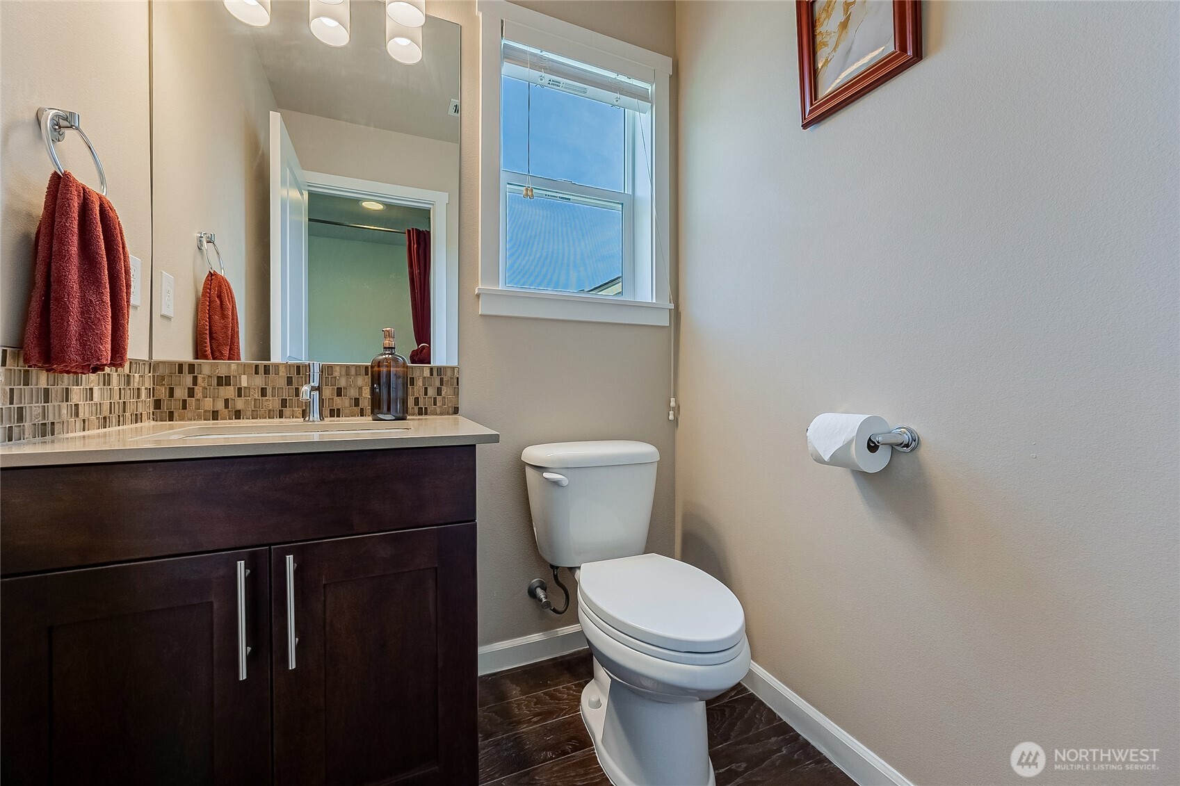 11501 87th Avenue South Seattle, WA 98178 - Photo 19 of 30 a bathroom with a sink a toilet and mirror