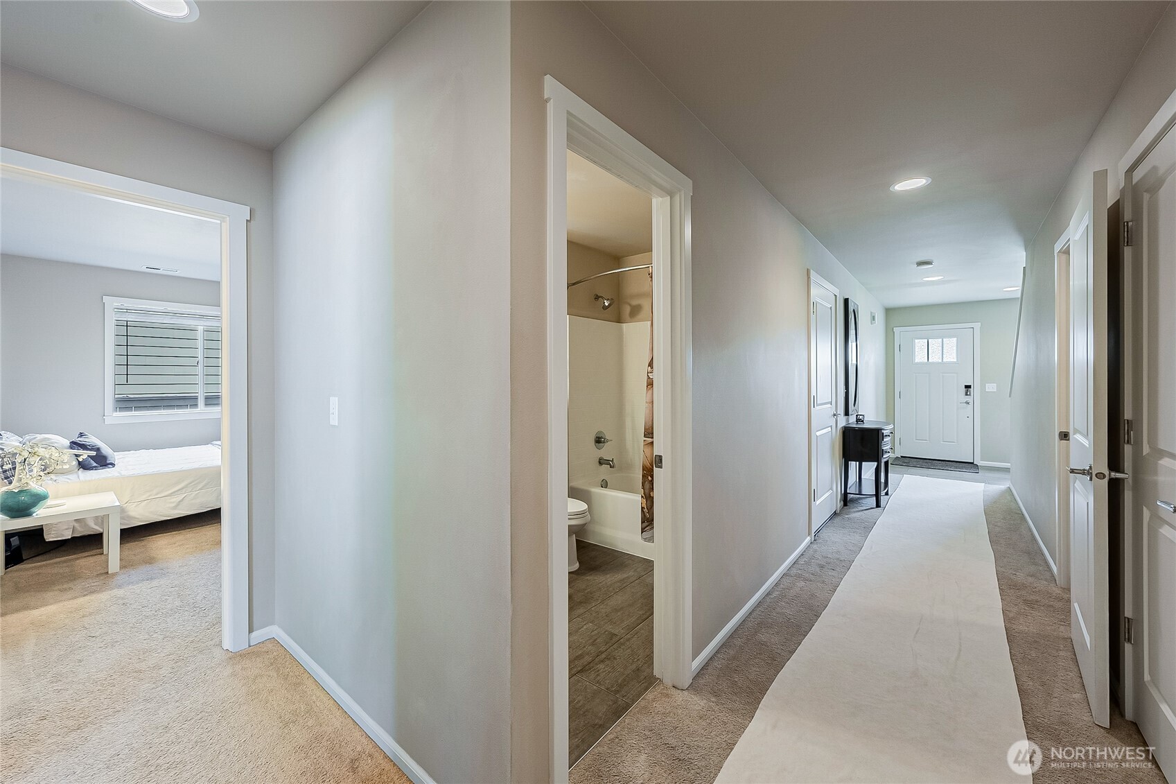 11501 87th Avenue South Seattle, WA 98178 - Photo 23 of 30 a hallway with kids room with couch and furniture