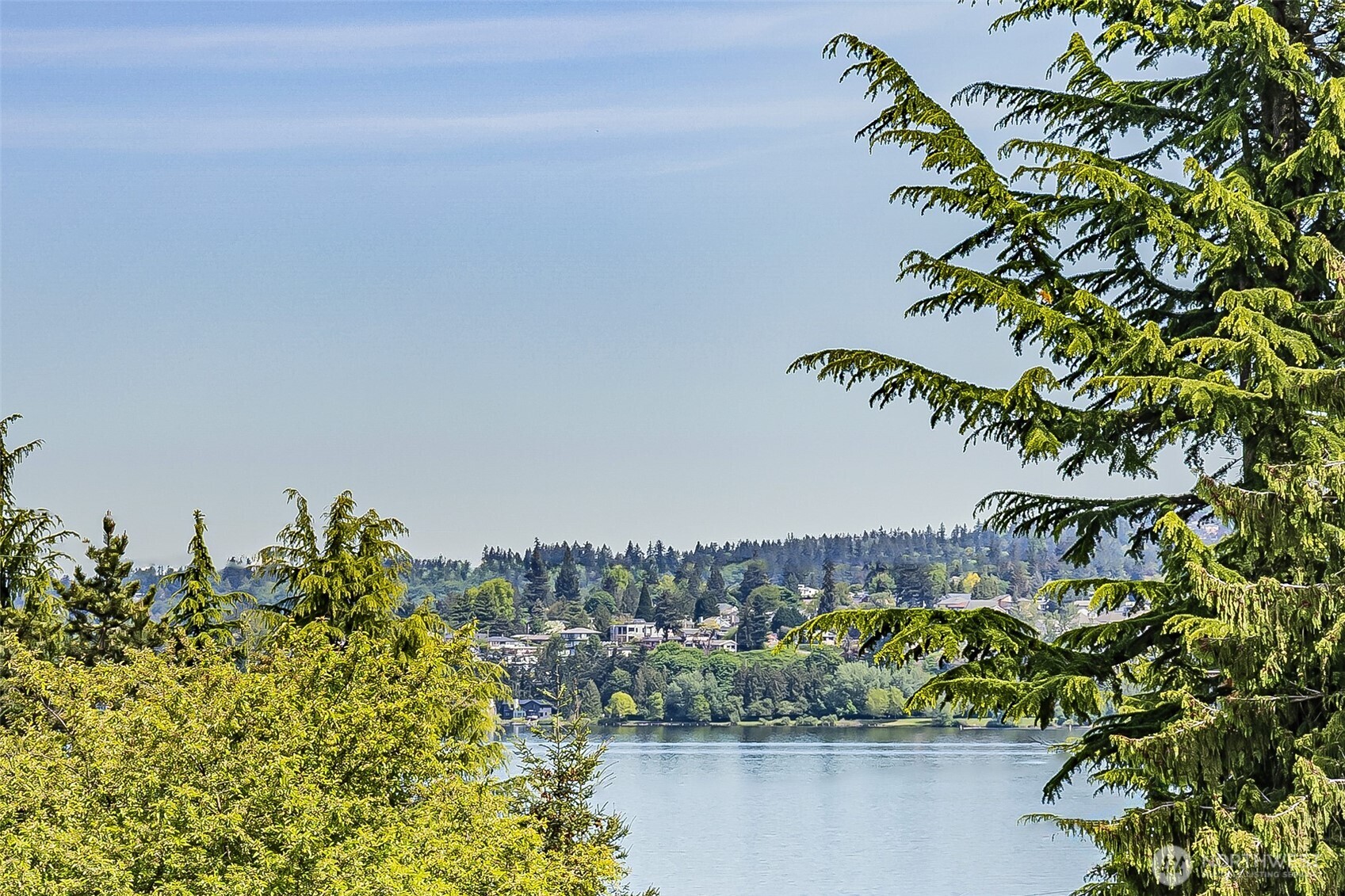 11501 87th Avenue South Seattle, WA 98178 - Photo 4 of 30 a view of a lake with a building in the background