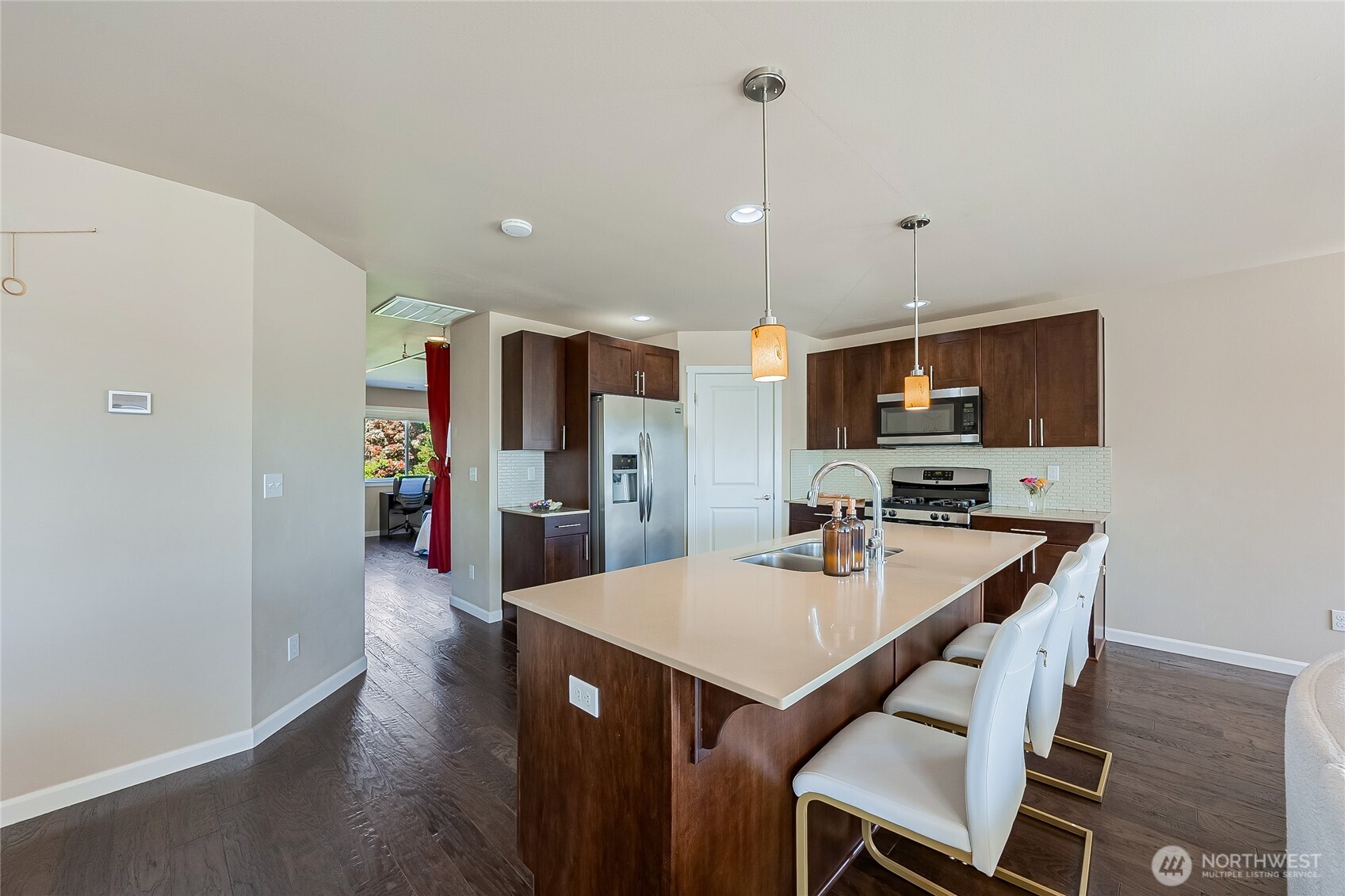 11501 87th Avenue South Seattle, WA 98178 - Photo 8 of 30 a kitchen with a dining table chairs stainless steel appliances and cabinets