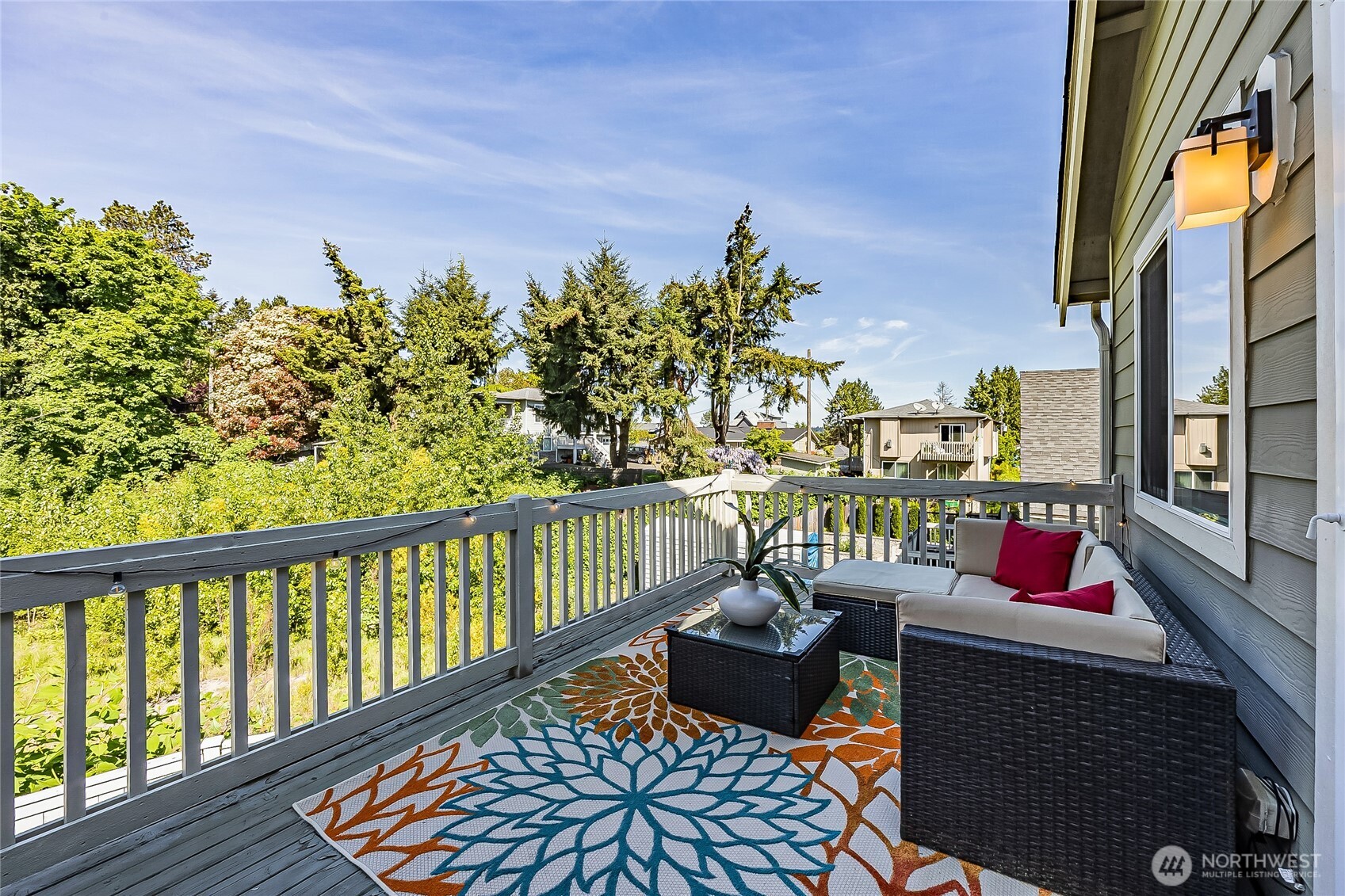 11501 87th Avenue South Seattle, WA 98178 - Photo 10 of 30 a balcony with wooden floor and outdoor seating