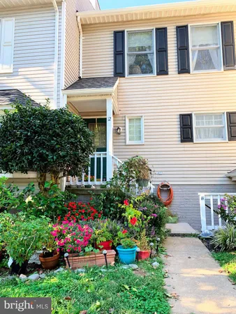 a view of a potted plant sitting in front of a house