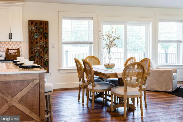 a living room with furniture a window and a fireplace
