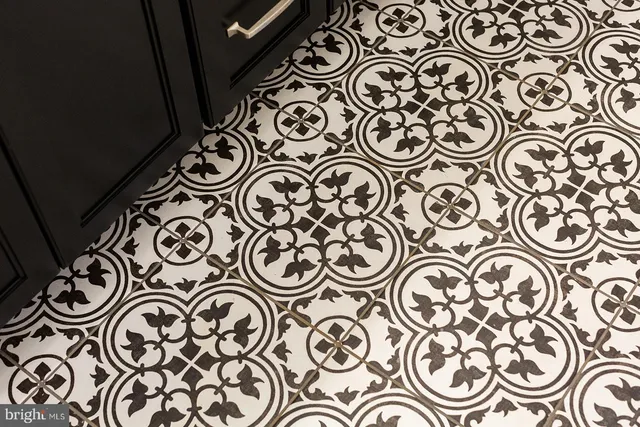 an outdoor space with a front view of a door and mirror