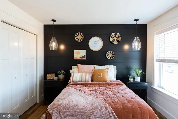 a bedroom with a bed and chair