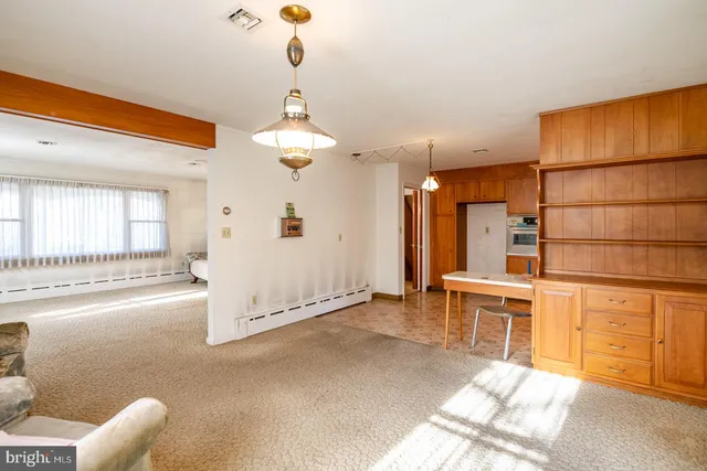 a kitchen with a sink and a refrigerator