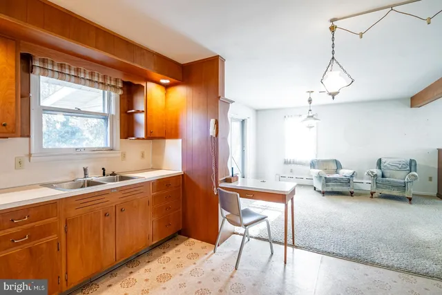 a kitchen with stainless steel appliances granite countertop a sink refrigerator stove and microwave