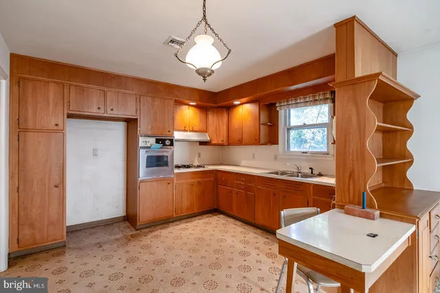 a spacious bathroom with a tub sink and mirror