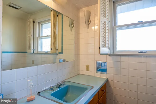 a living room with furniture rug and window