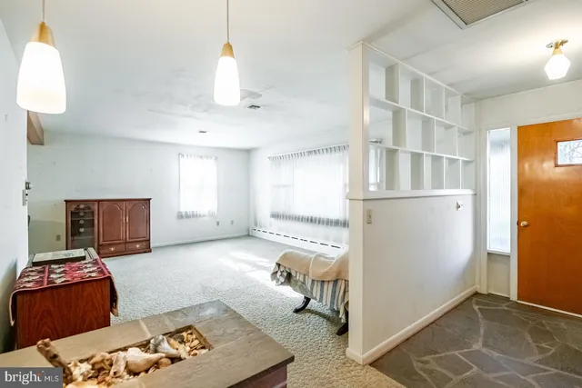 a room with a bed and a window