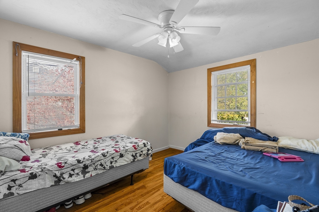 19-21 Bursley Road Weymouth, MA 02191 - Photo 11 of 33 a bedroom with bed and window