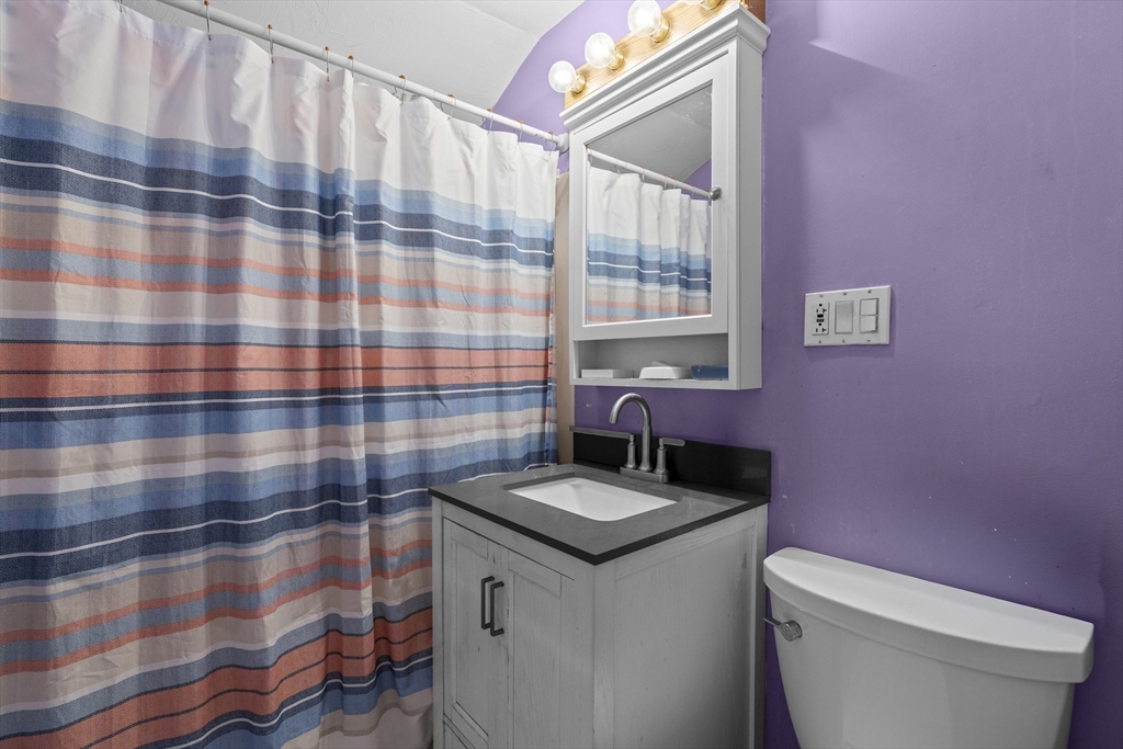 19-21 Bursley Road Weymouth, MA 02191 - Photo 14 of 33 a bathroom with a sink and mirror