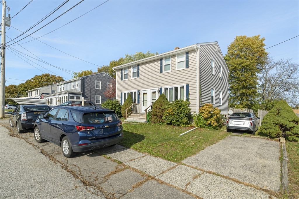 19-21 Bursley Road Weymouth, MA 02191 - Photo 2 of 33 a car parked in front of a house