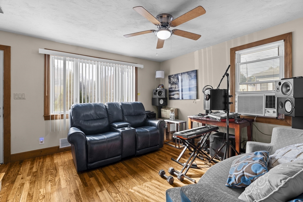 19-21 Bursley Road Weymouth, MA 02191 - Photo 5 of 33 a living room with furniture wooden floor and a window