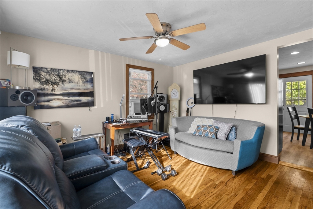 19-21 Bursley Road Weymouth, MA 02191 - Photo 6 of 33 a living room with furniture and a flat screen tv