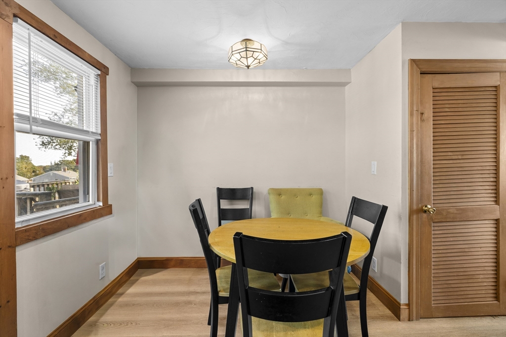19-21 Bursley Road Weymouth, MA 02191 - Photo 10 of 33 a view of a dining room with furniture and wooden floor