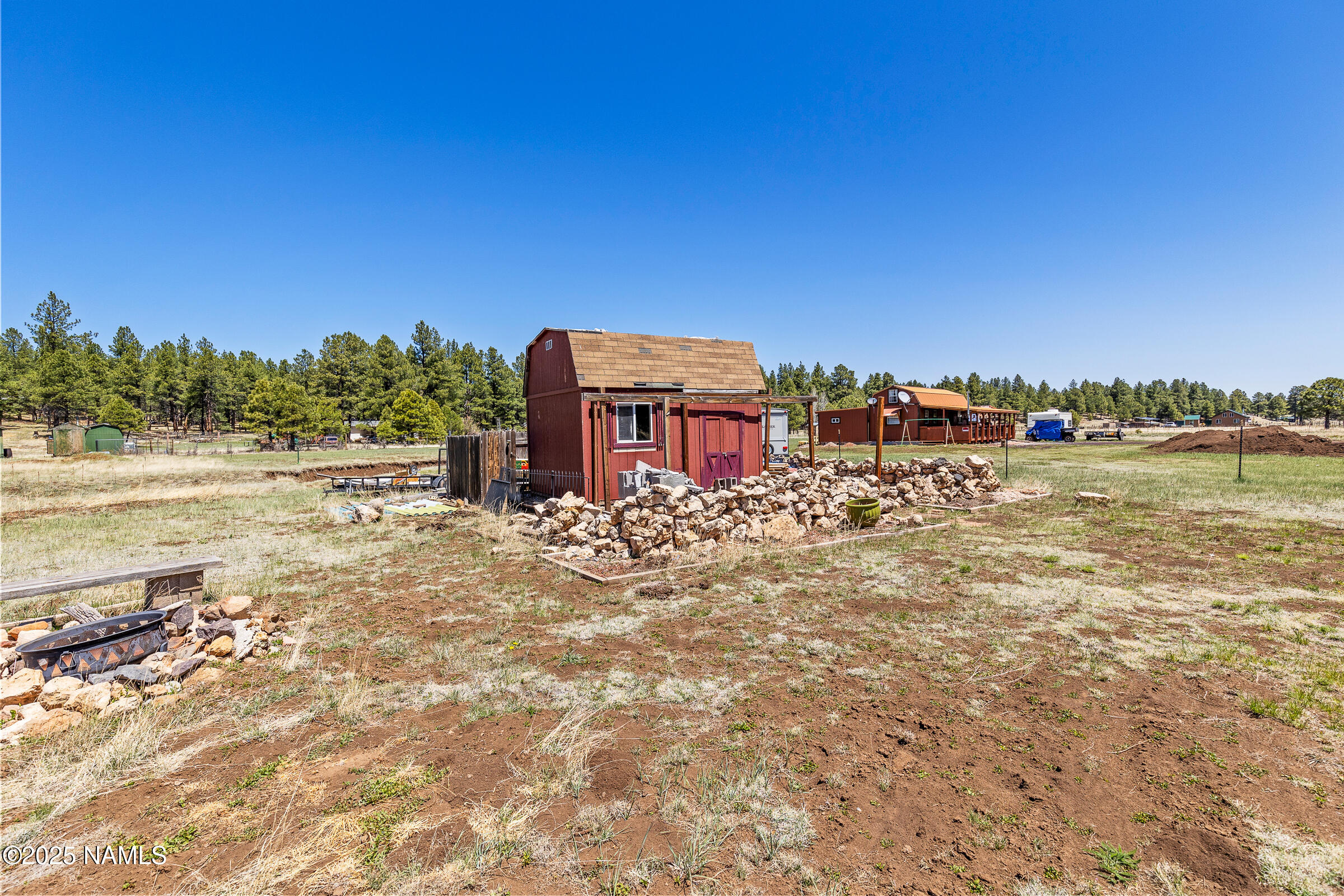 5984 Antelope Road Flagstaff, AZ 86005 - Photo 3 of 12 a view of a lake with a big yard