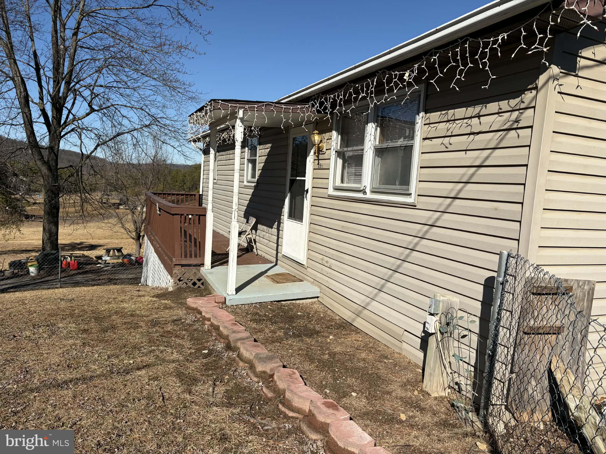 255 Redskins Lane Augusta, WV 26704 - Photo 2 of 35 a front view of a house with a yard