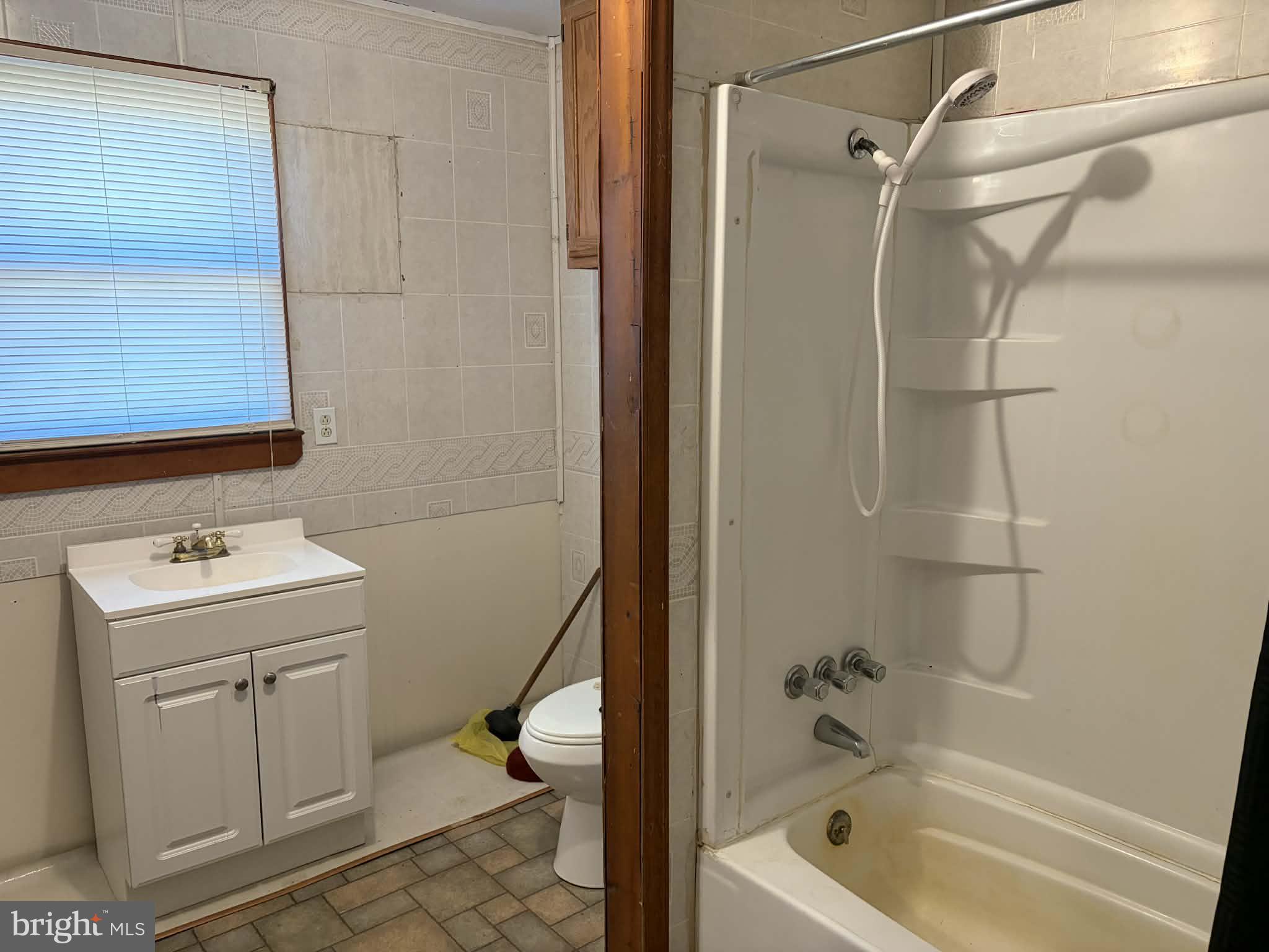 255 Redskins Lane Augusta, WV 26704 - Photo 24 of 35 a bathroom with a sink a toilet and shower