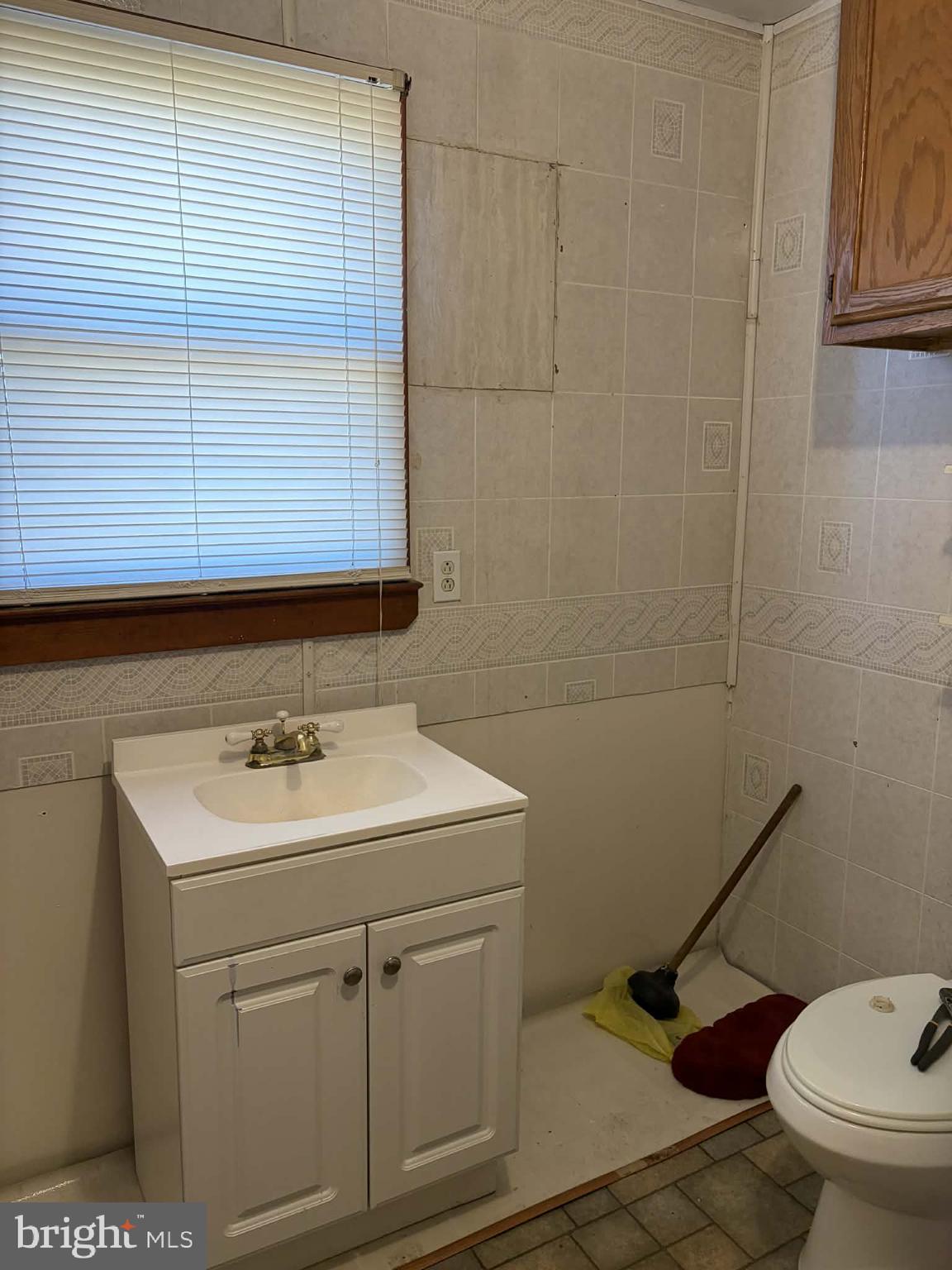 255 Redskins Lane Augusta, WV 26704 - Photo 25 of 35 a bathroom with a sink a toilet and a mirror