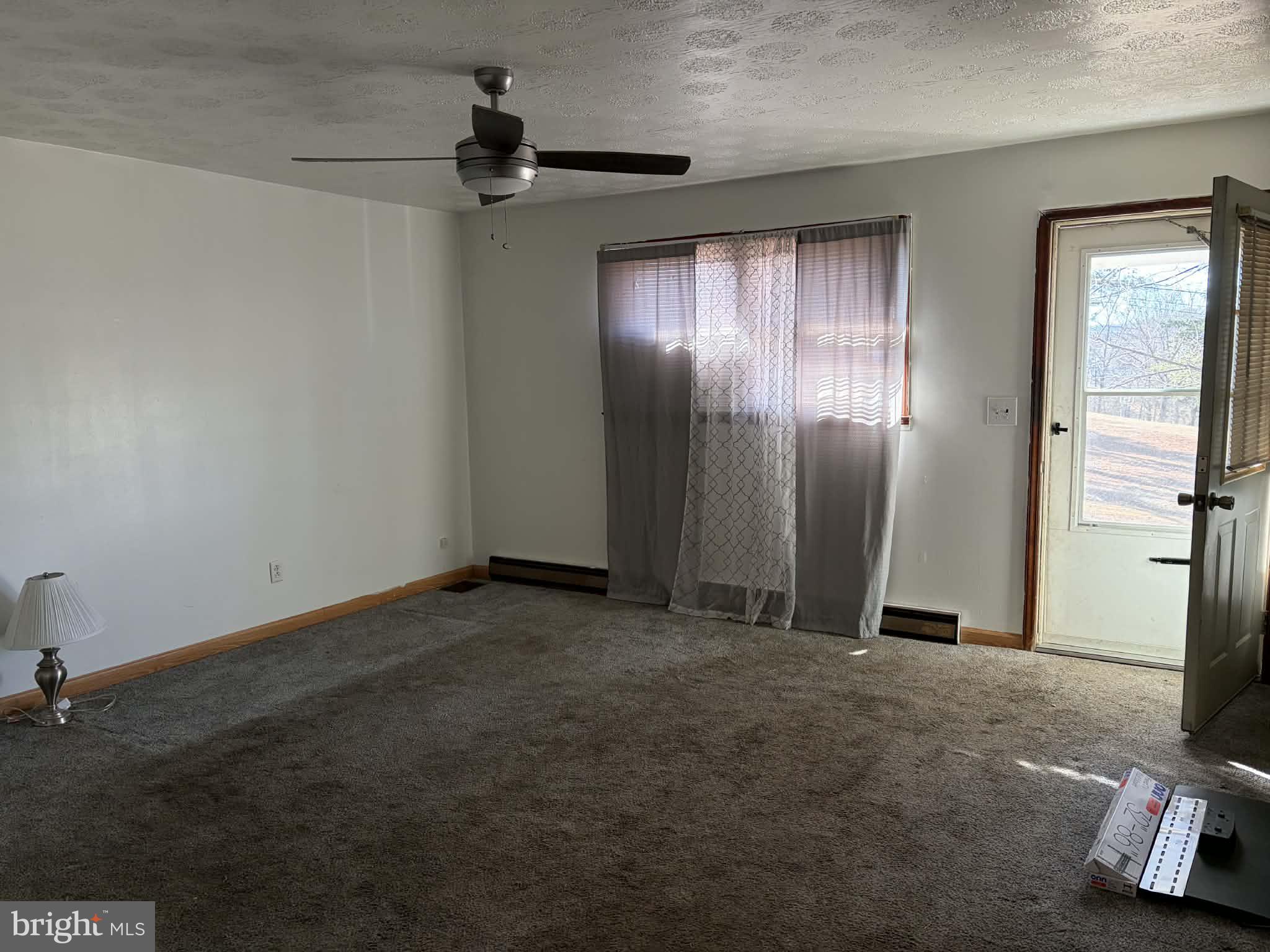 255 Redskins Lane Augusta, WV 26704 - Photo 8 of 35 an empty room with windows