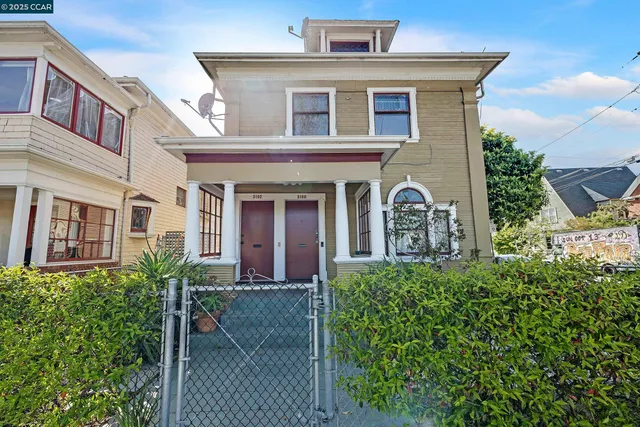 front view of a house with a small yard