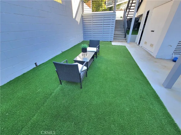 a backyard of a house with seating space