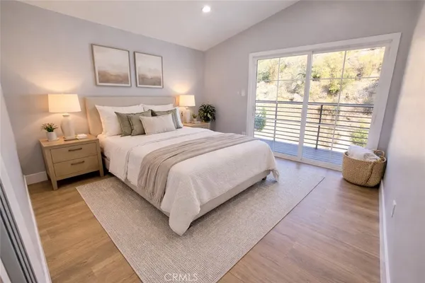 a bedroom with a bed and a couch