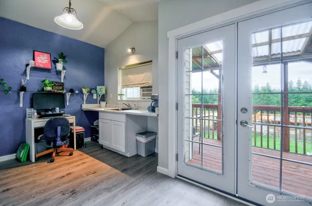 a view of a workspace and a window in kitchen