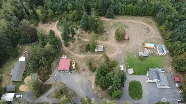 an aerial view of a house with outdoor space