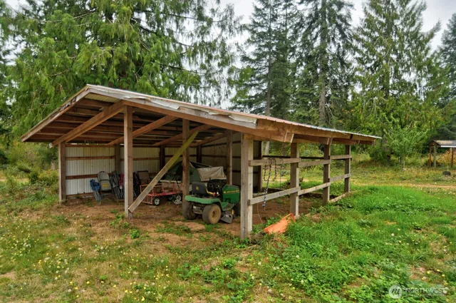 a view of a wooden deck with a trees and wooden fence