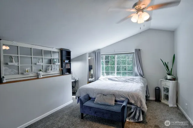 a bedroom with furniture and a window