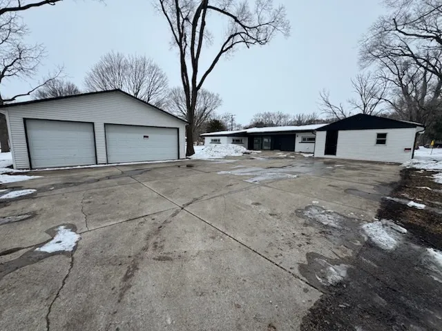 a view of a house with a snow and yard
