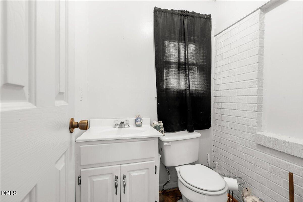109 Little Ponderosa Road Macon, NC 27551 - Photo 8 of 32 a bathroom with a sink toilet and shower