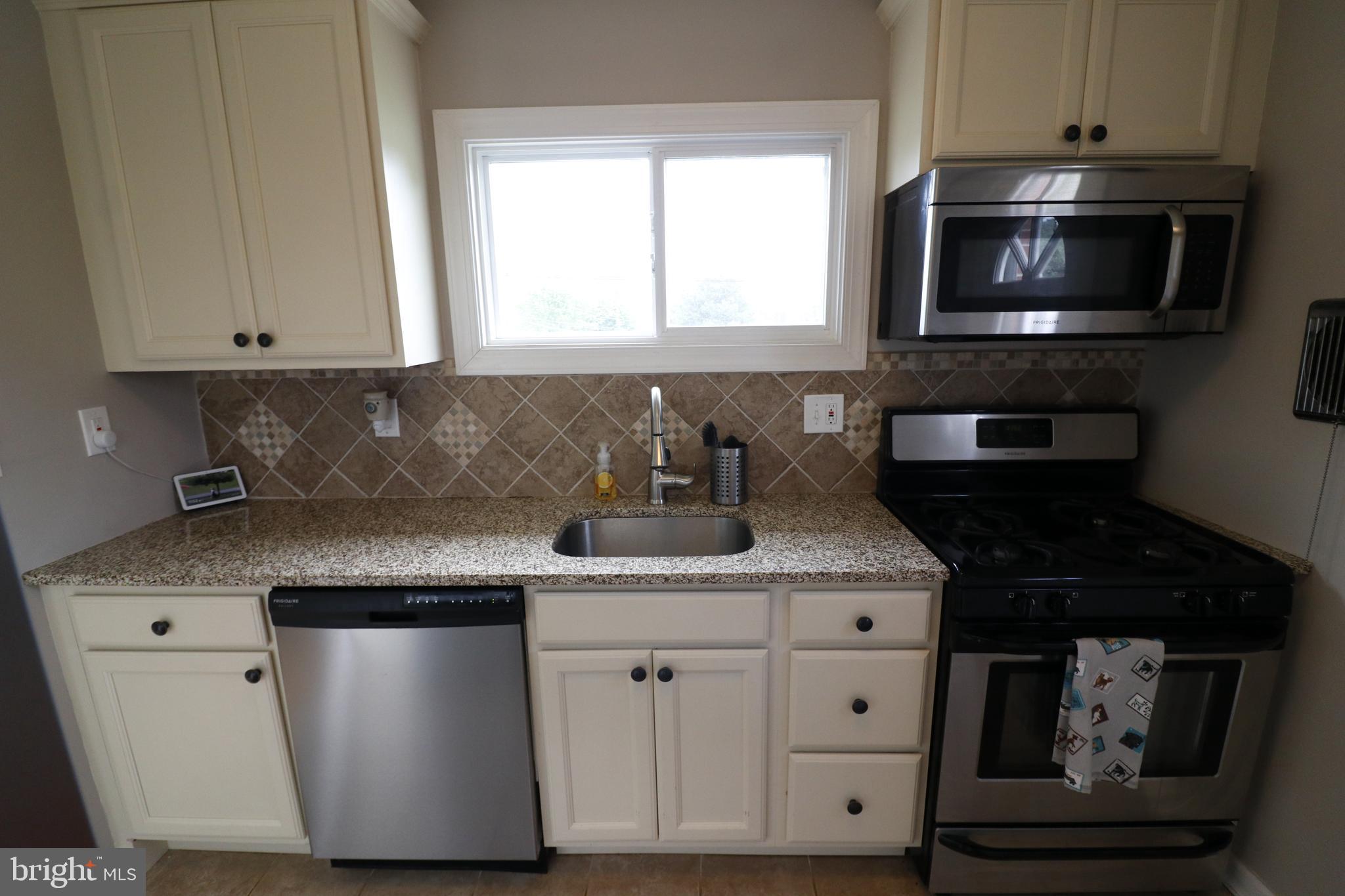 8601 Saddler Road Baltimore, MD 21234 - Photo 9 of 25 Granite and stainless steel kitchen