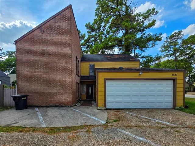 a front view of a house with a garage