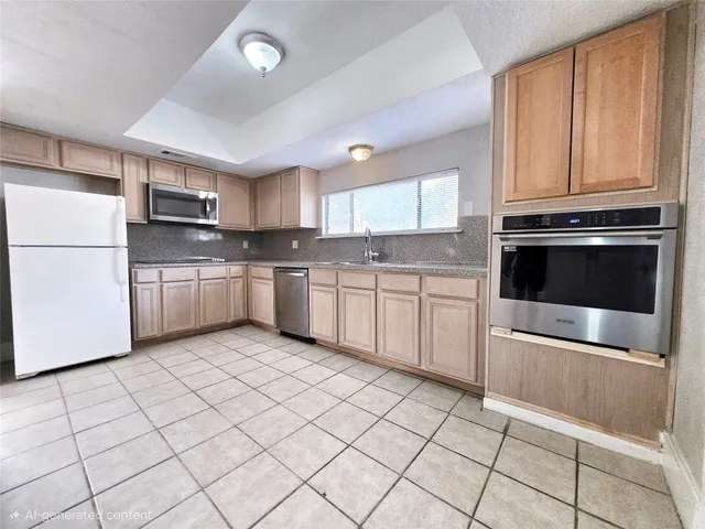 a kitchen with stainless steel appliances granite countertop a refrigerator sink and cabinets
