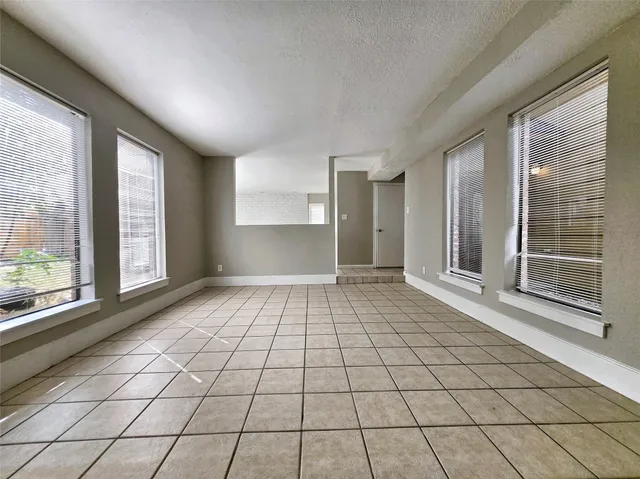 a view of empty room with windows