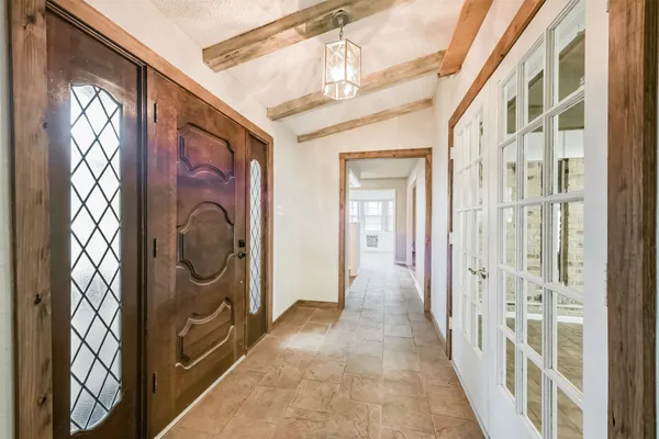 a view of a hallway with washer and dryer