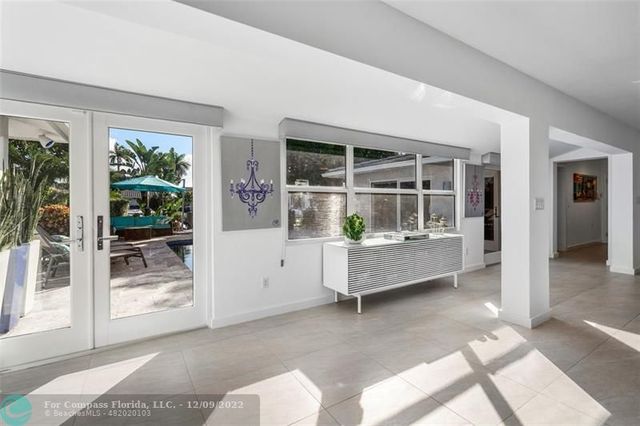 a bedroom with a bed and a night stand