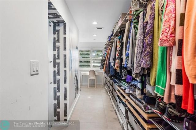 a bathroom with a double vanity sink toilet and shower