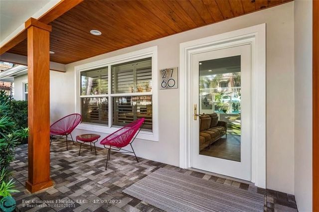 a view of a two chairs in the balcony