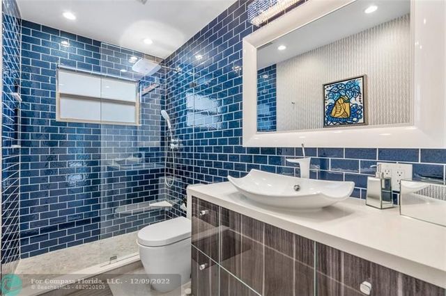 a bedroom with a bed and a chair with the outer view