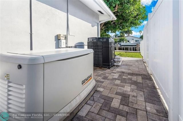 an aerial view of a house with a lake view
