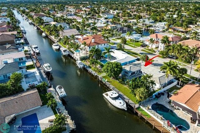 a view of a lake with couches and city view