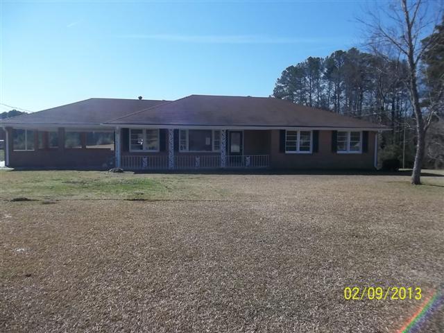 1328 Fairview Road Stockbridge, GA 30281 - Photo 1 of 1 a view of a house with a yard