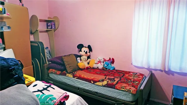 a bedroom with a bed and furniture