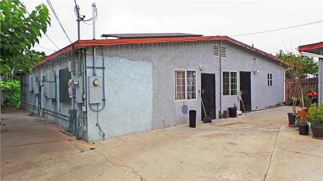 a front view of a house with wooden fence