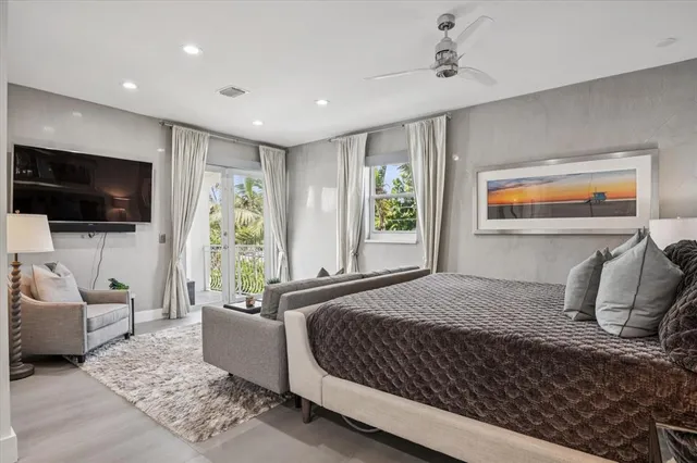 a bedroom with a bed and glass door